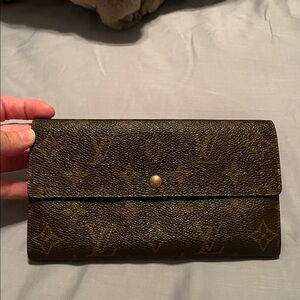 Louis Vuitton brown wallet..